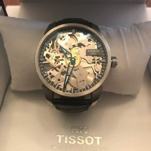 Tissot mechanical skeleton watch T0704051641100